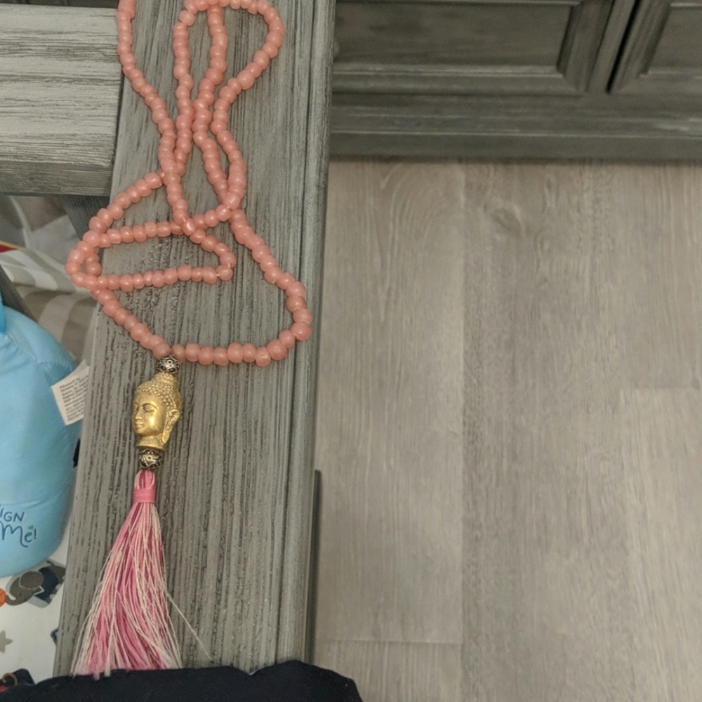Rose quartz and gold plated buddha necklace